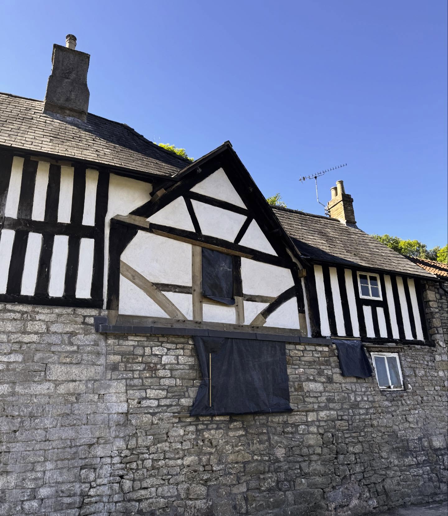 Progress with striking of scaffolding at a 13th century priory in rural Gloucestershire this week. The central later frame was suffering ongoing movement and significant water ingress. Our brief was to reinstate missing timbers which had been removed for a large UPVC window, realign the frame and carry out careful repairs to the stone and framework. Heavy cement render was removed from the stonework allowing the building to breath once again.
.
My thanks to Midlands Conservation for the their skill and expertise throughout and Forest of Dean Conservation team.
.
#timberframing #13thcentury #buildingconservation #listedbuilding #gloucestershire #oakframe #oakrepairs #buildingrepairs #listedbuildingconsent
